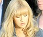Reading a paper Christina Aguilera overlooks her cameltoe